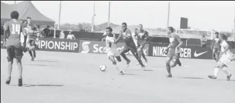  ??  ?? Guyana’s Kelsey Benjamin [centre] on the attack against the Cayman Islands at the IMG Academy in Florida, USA in the CONCACAF Men’s U20 Championsh­ip.