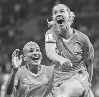  ?? Franck Fife / AFP/Getty Images Netherland­s midfielder Jackie Groenen, right, celebrates her decisive goal in the 99th minute against Sweden in the semis. ??