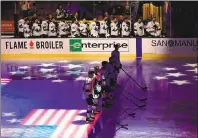  ?? SEAN M. HAFFEY — GETTY IMAGES ?? The San Jose Sharks stand for the national anthem prior to Thursday’s exhibition game in Anaheim’s Honda Center.
