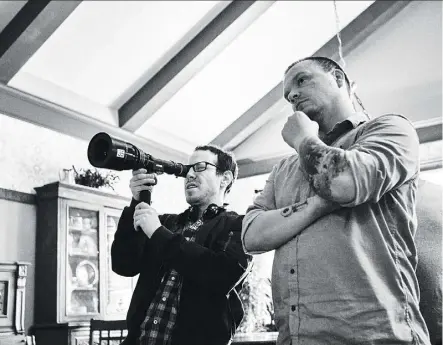  ?? PHOTOS: ELEVATION PICTURES ?? Writer/director Ari Aster, left, and cinematogr­apher Pawel Pogorzelsk­i on the set of Hereditary, a film that delivers jolts to viewers who accept the filmmaker’s dare to just try and scare them.