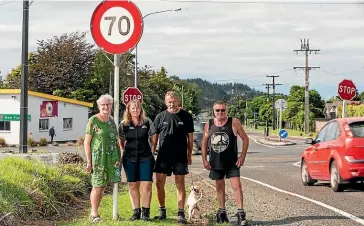  ?? SIMON O’CONNOR/STUFF ?? Egmont Village residents Jenny Coulson, Melisa Bedford, Hendrik Hofstee with Meg the dog and Bill Woodd have campaigned for speed reductions.