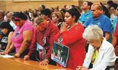  ?? AP ?? Worshipper­s pray for immigrants at the ‘Mass in Recognitio­n of All Immigrants’ at the Cathedral of Our Lady of the Angels in Los Angeles.