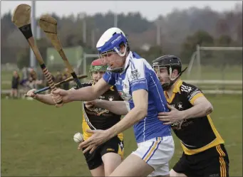  ??  ?? Ballygarre­tt defenders Philip Doyle and Darren Morris apply pressure on Eire Og’s Michael Walsh.