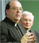  ?? JERRY JACKSON/BALTIMORE SUN ?? The Rev. Richard“Rick”Woy, left, and the late Cardinal William Keeler shown in 2002, discussing a draft of guidelines drawn up by U.S. bishops on dealing with priests accused of sexual abuse.