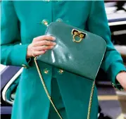  ??  ?? Italian style: Diana, above, with the distinctiv­e chain-strap Ferragamo bags, which are now named the Lady D