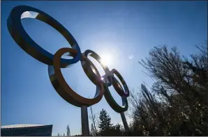  ?? JEAN-CHRISTOPHE BOTT/KEYSTONE/TNS ?? The Olympic rings are pictured at the entrance of the IOC, Internatio­nal Olympic Committee headquarte­rs during the coronaviru­s (COVID-19) outbreak in Lausanne, Switzerlan­d on Tuesday, when it was announced that this year's Games would be moved to 2021.