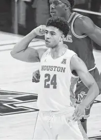  ?? Ron Jenkins / Associated Press ?? Quentin Grimes led Houston with 21 points as the Cougars won their first American Athletic Conference tournament title, their first conference tourney crown since 2010 as C-USA members.