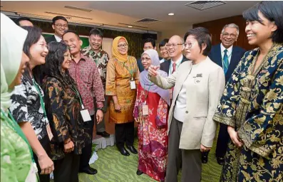  ??  ?? health concerns: Chew Mei Fun (third from right) gesturing as she speaks to conference participan­ts in Kuala Lumpur. Among the attendees are IPPF-EsEOR regional director Nora Murat (right) and National Population and Family Developmen­t Board Malaysia...