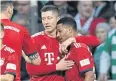  ?? REUTERS ?? Bayern’s Serge Gnabry is congratula­ted by Robert Lewandowsk­i.