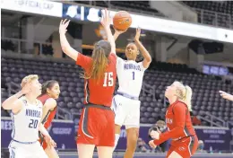  ?? COURTESY OF ROGER STEINMAN/CONFERENCE USA ?? ODU guard Maria Adams puts up a shot over Western Kentucky forward Raneem Elgedawy on Tuesday. Adams finished with 20 points.