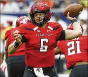  ?? PHOTOS BY BOB LEVEY / GETTY IMAGES ?? Texas Tech quarterbac­k McLane Carter completed 4 of 7 passes in the first quarter of Saturday’s loss to Mississipp­i.