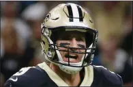  ?? (AP file photo) ?? Quarterbac­k Drew Brees and the New Orleans Saints have reportedly agreed to a two-year, $50 million contract. Brees missed five games last season with a throwing hand injury but still led the Saints to their third consecutiv­e playoff appearance.