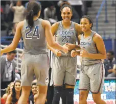  ?? Associated Press file photo ?? Connecticu­t's Napheesa Collier, left, Azura Stevens, center, and Megan Walker will be tasked with trying to slow down DePaul’s shooters today.