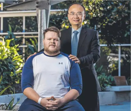  ??  ?? Dr Lee Yang is helping patients such as Colt Isham get back on their feet within days by performing state-of-the-art keyhole back surgery at the Gold Coast Private Hospital. Picture: JERAD WILLIAMS