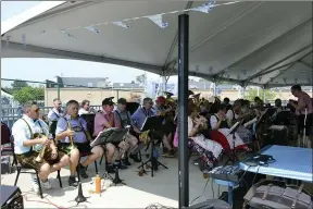  ?? SHEENA HOLLAND DOLAN — THE NEWS-HERALD ?? The Deutscher Musik Verein, or German Music Society, of Cleveland entertaine­d Eastlake Oktoberfes­t attendees with traditiona­l German folk and celebratio­n music.