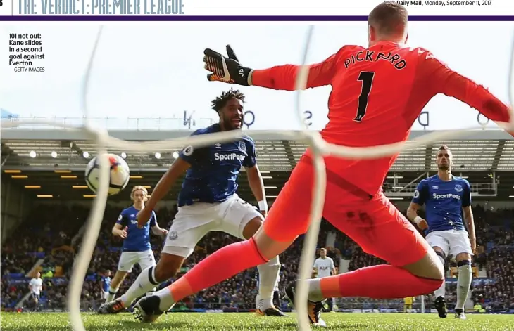  ?? GETTY IMAGES ?? 101 not out: Kane slides in a second goal against Everton