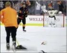  ?? MATT SLOCUM — THE ASSOCIATED PRESS ?? Philadelph­ia Flyers’ Sean Couturier, center, skates off the ice after scoring his third goal of the night during the third period Wednesday in Philadelph­ia.