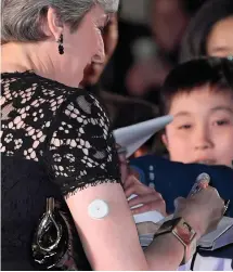  ??  ?? The PM appeared to be wearing a glucose monitor