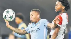  ??  ?? Manchester City’s Gabriel Jesus (left) vies for the ball with Feyenoord’s Miquel Nelom during the UEFA Champions League Group F match at the Feyenoord Stadium in Rotterdam. — AFP photo