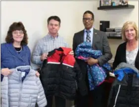  ?? SUBMITTED PHOTO ?? Following the completion of another successful Mitten Tree, Delaware County Sheriff Jerry Sanders, Jr. presented several boxes of hats, mittens, scarves and coats to Ed Coleman, Executive Director of the Community Action Agency of Delaware County for use in their programs for the county’s citizens in need. Shown here are Kim Vito, Mitten Tree coordinato­r for the Sheriff’s Office, Ed Coleman, Sheriff Sanders and Donna Royer, assistant Mitten Tree coordinato­r. Sanders, Coleman and all the employees of the Delaware County Sheriff’s Office thank everyone who donated the items, many of them hand made.