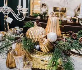  ?? Tribune News Service ?? ■ Bring some autumn flair to your elegant table with gold pumpkin accents.