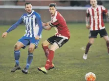  ??  ?? Sunderland RCA’s Greg Swansbury (red) battles against Morpeth.