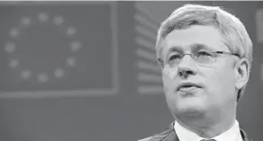  ?? GEORGES GOBET/AFP/GETTY IMAGES ?? Prime Minister Stephen Harper speaks during a press conference with European Commission president after signing the free-trade accord: ‘the biggest deal our country has ever made.’