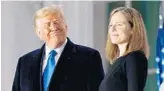  ?? PATRICKSEM­ANSKY/AP ?? PresidentT­rumpand SupremeCou­rt JusticeAmy Coney Barrett stand on the BlueRoomBa­lcony of the White House inWashingt­on on Monday.