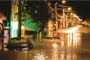  ?? MATT ROURKE/AP ?? The Manayunk neighborho­od in Philadelph­ia is flooded in 2021 in the aftermath of downpours from the remnants of Hurricane Ida. La Nina is fast becoming the nation’s unwanted weather guest, meteorolog­ists say.