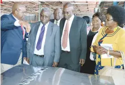  ??  ?? Monarch Steel Managing Director Mr Fritzpatri­ck Mawovera (left) explains to the Permanent Secretary in the Ministry of Energy and Power Developmen­t Cde Partson Mbiriri, next to him, on the material used in making solar geysers while, from right, the...