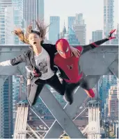  ?? PICTURES MATT KENNEDY/SONY ?? MJ (Zendaya) and Spider-man (Tom Holland) jump off a bridge in “Spider-man: No Way Home.”