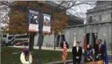  ?? CARL HESSLER JR. — DIGITAL FIRST MEDIA ?? The Montgomery County commission­ers view the latest “Hometown Hero” banner unveiled at courthouse on Veterans Day to honor Marine Capt. Samuel Schultz, 28, of Abington.