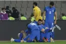  ?? ?? Azerbaijan’s players celebrate a goal in their historic 3-0 win over Sweden. Photograph: Tofik Babayev/AFP/Getty Images