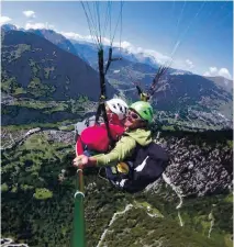  ?? ?? ● Paraglidin­g above Verbier.