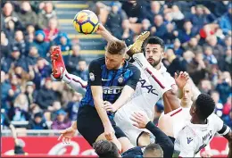  ??  ?? Inter Milan’s Milan Skriniar (top left), jumps for the ball during the Serie A soccer match between Inter Milan and Bologna at the San Siro Stadium in Milan, Italy on
Feb 11. (AP)