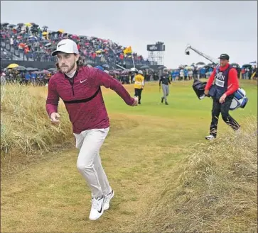  ?? Will Oliver EPA/Shuttersto­ck ?? SOMEONE FORGOT to tell Tommy Fleetwood that Saturday, not Friday, is the traditiona­l “moving day” at a golf tournament. Fleetwood, who contended at the U.S. Open, is one shot back at Carnoustie after a 65.