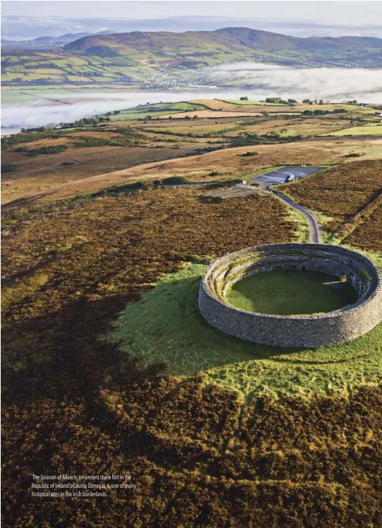  ??  ?? The Grianan of Aileach, an ancient stone fort in the Republic of Ireland’s County Donegal, is one of many historical sites in the Irish borderland­s.