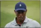  ?? MATT SLOCUM — AP ?? Tiger Woods works out on the range during a practice for the Masters at Augusta National Golf Club on Tuesday in Augusta, Ga.