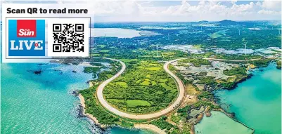  ?? Province. Photo: Xinhua/Pu Xiaoxu ?? This aerial photo taken on Oct. 6, 2022 shows a section of the round-the-island tourist highway in Danzhou, south China’s Hainan