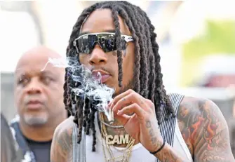  ?? DIA DIPASUPIL/GETTY IMAGES ?? Rapper Wiz Khalifa plans to launch Hotbox by Wiz in October.
