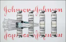  ?? JUSTIN TALLIS/AFP VIA GETTY IMAGES ?? An illustrati­on shows vials with COVID-19 vaccine stickers attached and syringes with the logo of US pharmaceut­ical company Johnson & Johnson on Nov. 17, 2020. In a large, late-stage trial the Johnson & Johnson’s one-dose vaccine prevented 66% of moderate to severe cases of COVID-19.