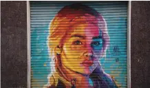  ??  ?? A graffiti by street artist “Axe Colors” portraying British actress Emilia Clarke known for playing Daenerys Targaryen in The Game of Thrones TV series.