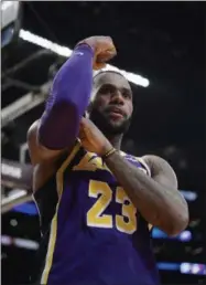  ?? MARK J. TERRILL - THE ASSOCIATED PRESS ?? Los Angeles Lakers forward LeBron James gestures after scoring during the second half of the team’s NBA basketball game against the Denver Nuggets on Wednesday, March 6, 2019, in Los Angeles. The Nuggets won 115-99.