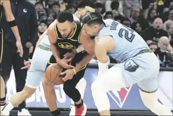  ?? KAREN PULFER FOCHT/AP ?? MEMPHIS GRIZZLIES’ DILLON BROOKS (24) and Golden State Warriors’ Stephen Curry (30) battle for the ball in the first half of Game 5 of a second-round playoff series on Wednesday in Memphis, Tenn.