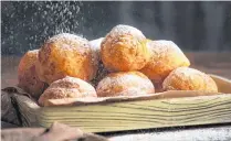  ?? CONTRIBUTE­D ?? Ukrainian pampushky are light and airy and simply adorned with sugar and cinnamon.