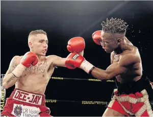  ?? /GALLO IMAGES ?? DeeJay Kriel, left, in a fight against Xolisa Magusha. On Sunday Kriel faces Carlos Licona in US for IBF mini-flyweight title.