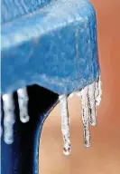  ?? [PHOTO BY NATE BILLINGS, THE OKLAHOMAN] ?? Icicles hang from a garbage can in northwest Oklahoma City on Saturday.