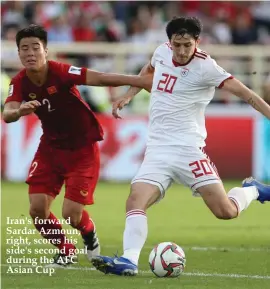  ??  ?? Iran's forward Sardar Azmoun, right, scores his side's second goal during the AFC Asian Cup