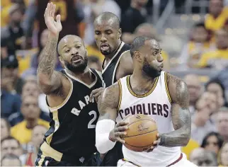  ?? TONY DEJAK/THE ASSOCIATED PRESS ?? If LeBron James and the Cleveland Cavaliers continue their one-sided run past the Raptors, it might give Toronto management pause to consider whether to offer Serge Ibaka, centre, a new long-term contract after the season, writes Scott Stinson.