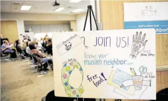  ?? Elizabeth Conley / Staff photograph­er ?? Visitors to the event could get their hands painted with henna, try on a hijab and learn more deeply about the history of those who follow Islam.